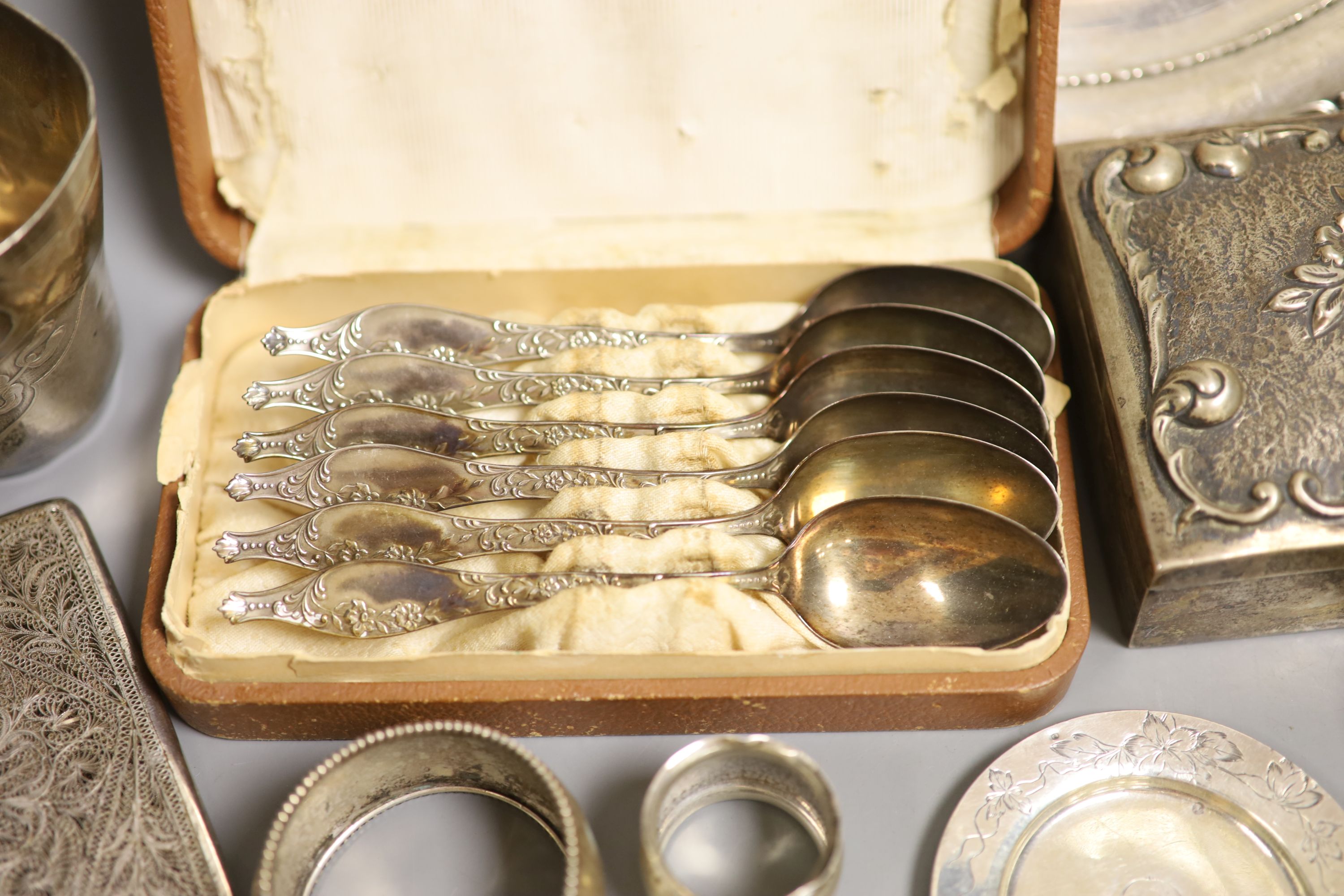 A collection of continental white metal items including 800 cigarette box, sterling plate, Tiffany & Co small dish, flatware etc.